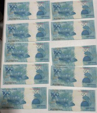 cédulas falsas de R$100,00 escondidas em livro de palavras cruzadas